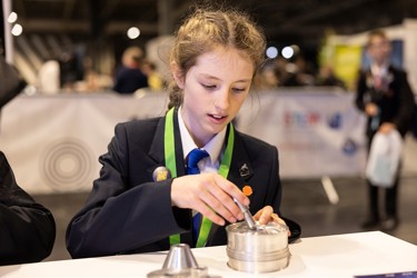 A young person at The Big Bang Fair interacts with one of the displays