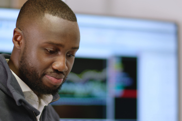 A man reviewing information and processing data