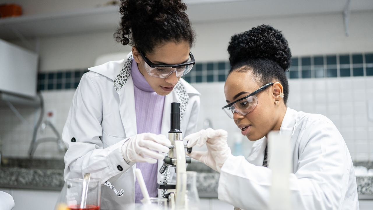 Scientists in a lab surrounded by equipment
